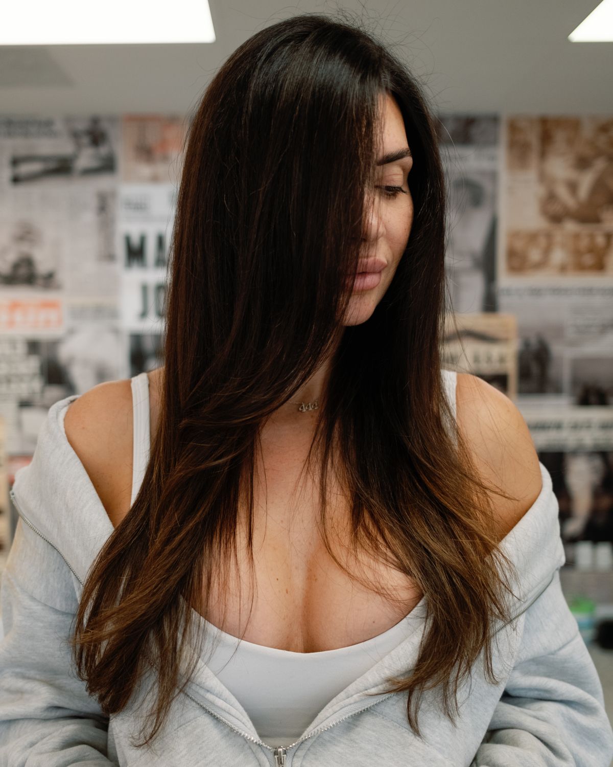 Long glossy brunette by Vintage Roots Salon